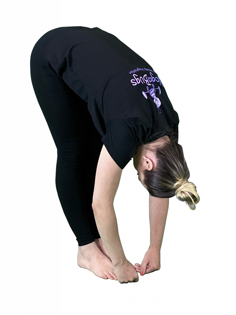 yoga teacher demonstrating forward bend pose